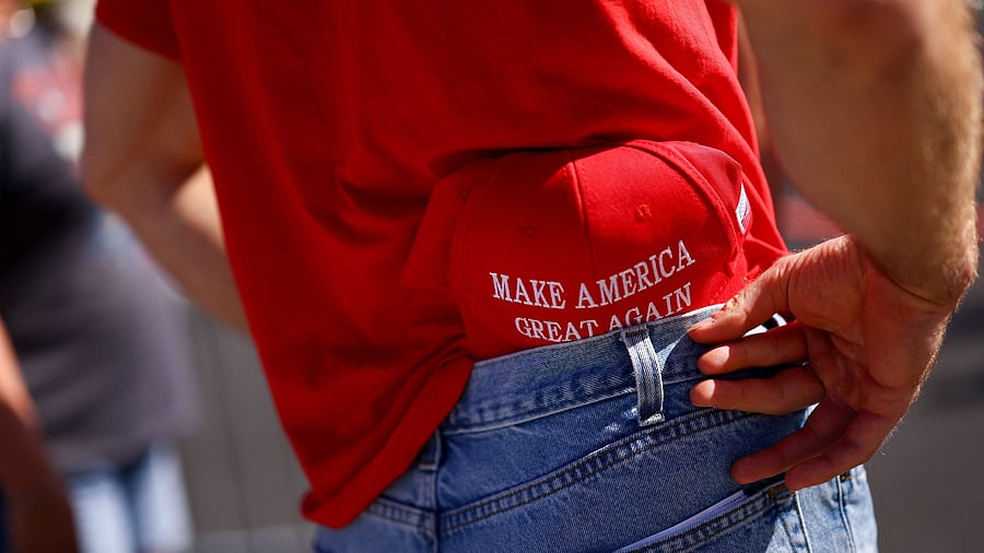 <div class="paragraphs"><p>A supporter with a MAGA hat </p></div>