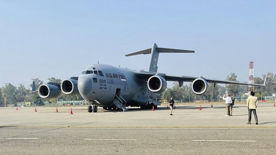 <div class="paragraphs"><p>A US military aircraft carrying illegal Indian immigrants upon its landing at the Shri Guru Ramdas Ji International Airport, in Amritsar.</p></div>