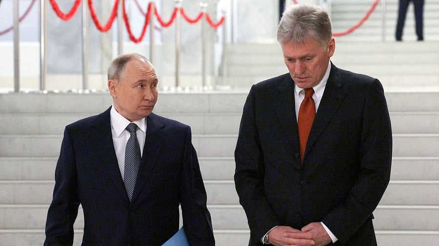 <div class="paragraphs"><p>Russian President Vladimir Putin and Kremlin spokesman Dmitry Peskov walk before a meeting </p></div>