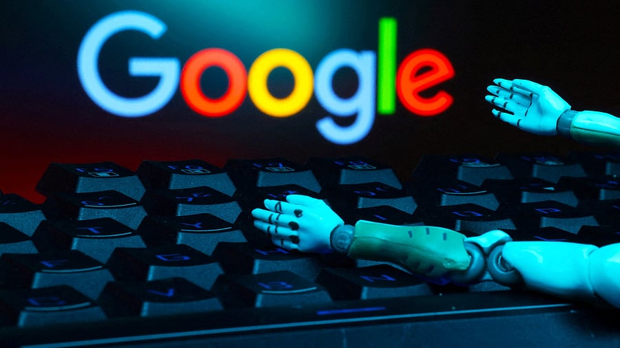 <div class="paragraphs"><p>The Google logo, a keyboard, and robot hands are seen in this illustration </p></div>