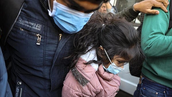 <div class="paragraphs"><p>A Gujarat native, who was among the Indians deported from US, being escorted from the Ahmedabad airport, Thursday, Feb. 6, 2025.</p></div>