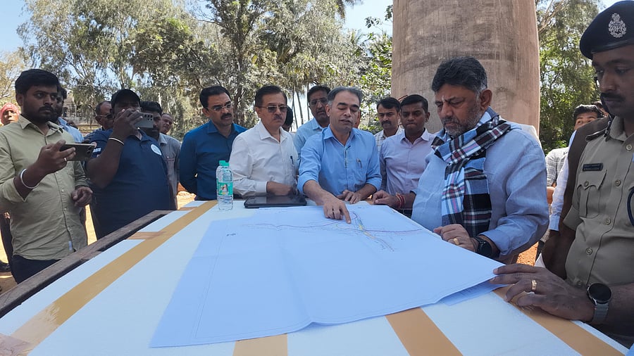 <div class="paragraphs"><p>Deputy Chief Minister D K Shivakumar inspects the blueprint of the project on Thursday.</p></div>