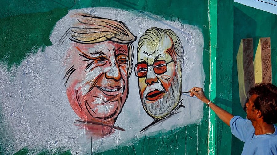 <div class="paragraphs"><p>A man applies finishing touches to paintings of US President Donald Trump and India's Prime Minister Narendra Modi on a wall. Representative image.</p></div>