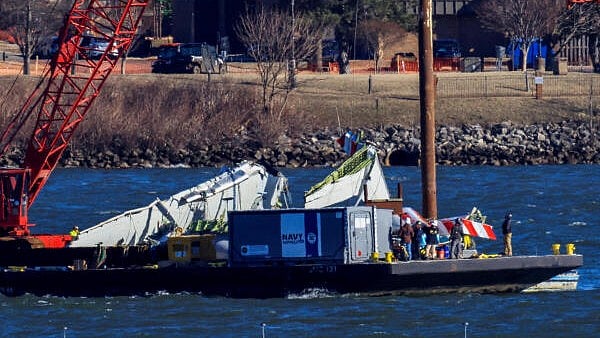 <div class="paragraphs"><p>A crane retrieves part of the wreckage from the Potomac River, in the aftermath of the collision of American Eagle flight 5342 and a Black Hawk helicopter that crashed into the river, by the Ronald Reagan Washington National Airport, in Arlington, Virginia, US.</p></div>