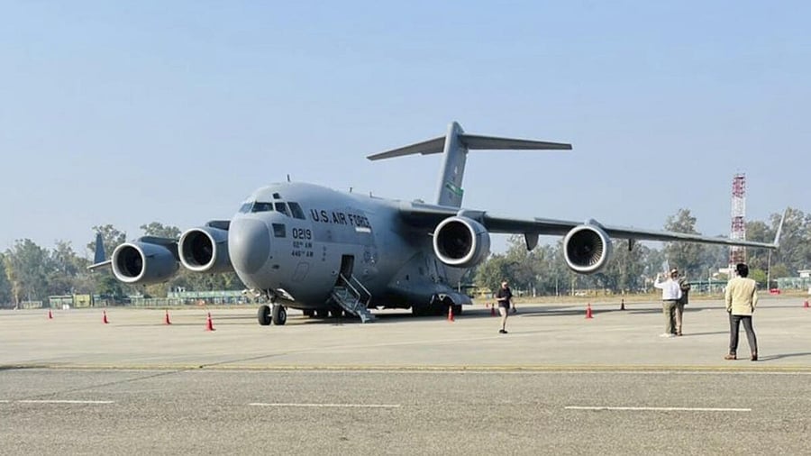 <div class="paragraphs"><p>A US military aircraft carrying illegal Indian immigrants upon its landing at the Shri Guru Ramdas Ji International Airport, in Amritsar, Punjab</p></div>