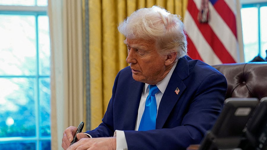 <div class="paragraphs"><p>US President Donald Trump signs a document in the Oval Office at the White House in Washington, February 4, 2025.</p></div>