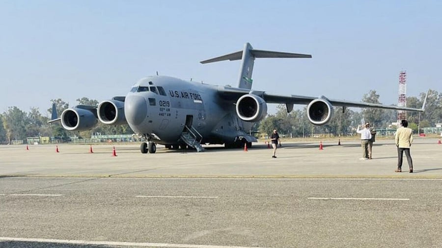 <div class="paragraphs"><p>A US military aircraft carrying illegal Indian immigrants upon its landing at the Shri Guru Ramdas Ji International Airport, in Amritsar, Punjab, Wednesday, Feb. 5, 2025. 104 Indian migrants were deported from the US on Wednesday afternoon, according to officials.</p></div>