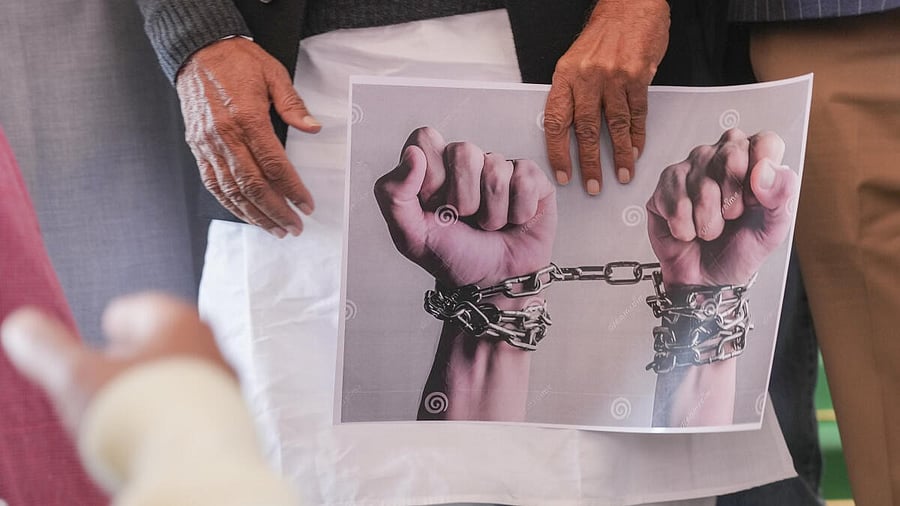 <div class="paragraphs"><p>A poster, seen at a protest of opposition MPs over the deportation of Indian immigrants from the US, at Parliament House complex during the Budget session in New Delhi.</p></div>