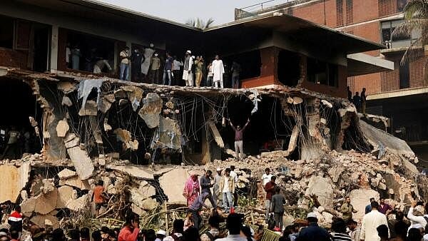 <div class="paragraphs"><p>Protesters and observers gather to see the demolished Dhanmondi-32 residence of Bangabandhu Sheikh Mujibur Rahman, father of the ousted PM Sheikh Hasina, in Dhaka, Bangladesh February 6, 2025.</p></div>