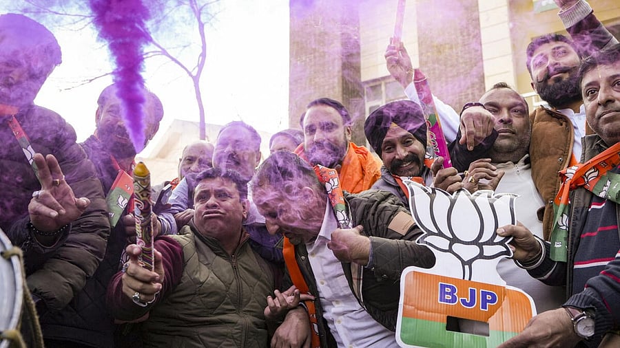 <div class="paragraphs"><p>Bharatiya Janata Party supporters celebrate after the party secured a majority in the Delhi Assembly elections amid the counting of votes, in Amritsar, Punjab, Saturday, Feb. 8, </p></div>