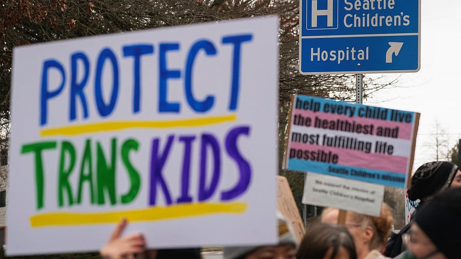 <div class="paragraphs"><p>Demonstrators gather for a rally in support of trans youth at Seattle Children's hospital, following US President Donald Trump's executive order that denies federal funding for pediatric gender-affirming care, in Seattle, Washington,  February 8, 2025.</p></div>