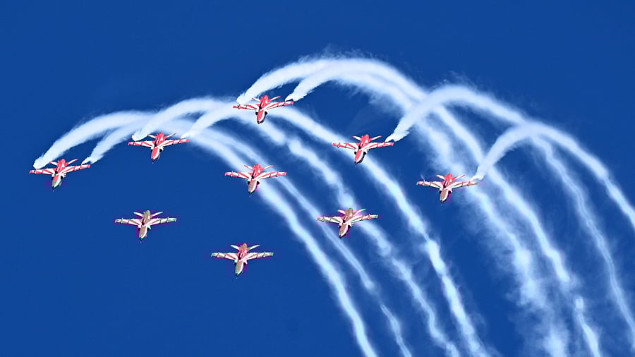 <div class="paragraphs"><p>The Surya Kiran Aerobatic Team (SKAT) performs a sortie during the dress rehearsal of Aero India 2025 at the Yelahanka Airbase on Thursday. </p></div>