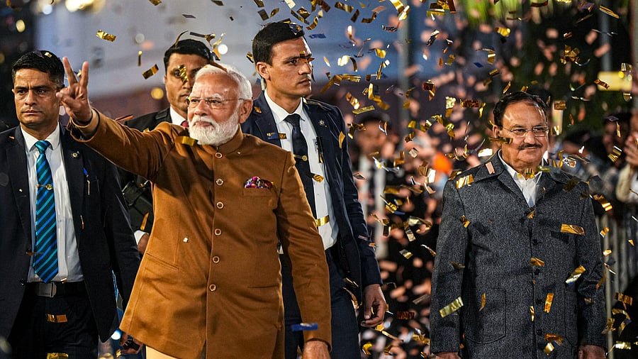 <div class="paragraphs"><p>Prime Minister Narendra Modi greets supporters upon his arrival at BJP headquarters, on the day of counting of votes for Delhi Assembly elections, in New Delhi, Saturday, Feb. 8, 2025. Union Minister and BJP National President J P Nadda is also seen.</p></div>