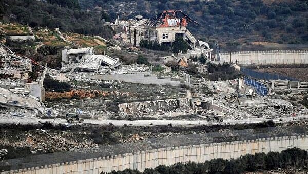 <div class="paragraphs"><p>Israeli military vehicles drive past destruction in southern Lebanon, as seen from northern Israel, after a ceasefire between Israel and Hezbollah took effect, January 26, 2025.</p></div>