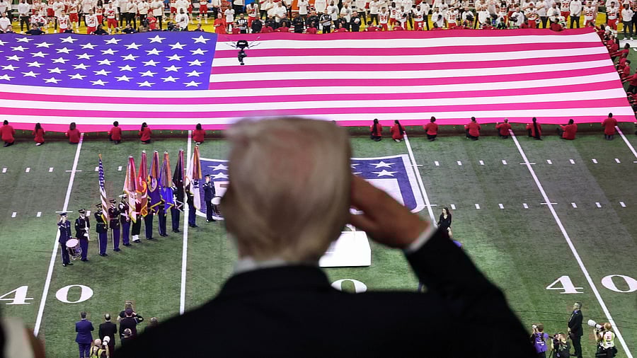 <div class="paragraphs"><p>US President Donald Trump salutes during the national anthem at the Super Bowl in New Orleans</p></div>