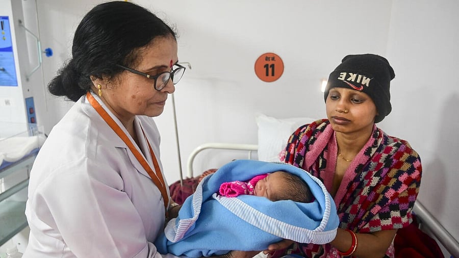 <div class="paragraphs"><p>Neha Singh with her newborn and matron Rama Singh, left, at the Central Hospital during the ongoing Maha Kumbh Mela.&nbsp;</p></div>