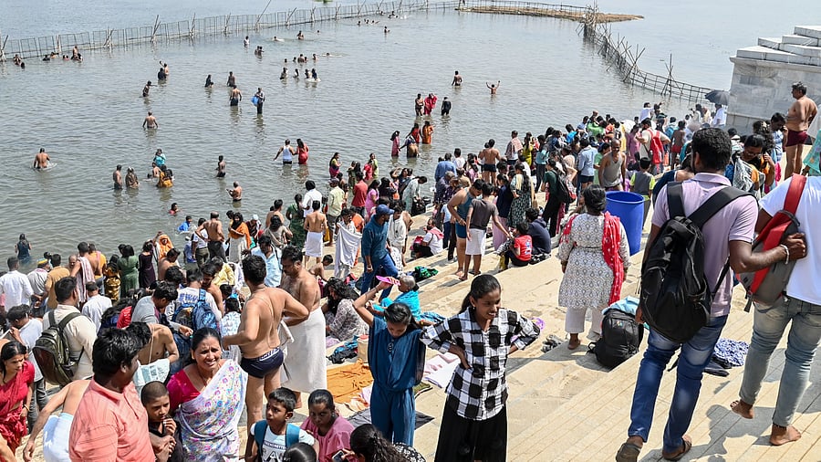 <div class="paragraphs"><p>Devotees take a holy dip at Triveni Sangama in T Narsipur town, Mysuru district, as part of the three-day 13th Kumbha Mela, on Monday. </p></div>