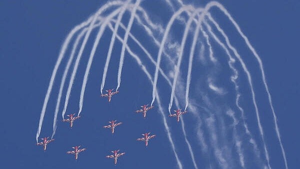 <div class="paragraphs"><p>IAF's Surya Kiran Aerobatic Team (SKAT) showcases aerobatic skills during the inauguration of the 15th edition of Aero India 2025 at Yelahanka Airbase, in Bengaluru, Karnataka, on Monday.</p></div>