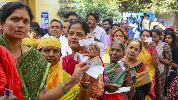 <div class="paragraphs"><p>Female voters wait in a queue to cast their votes for the municipal elections at a polling station at Jagdalpur in Bastar district, Tuesday, Feb. 11, 2025.</p></div>