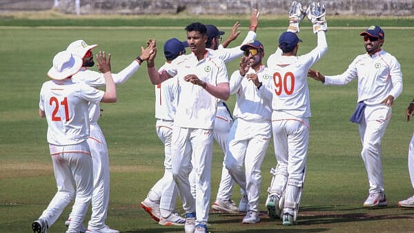 <div class="paragraphs"><p>Vidarbha's Nachiket Bhute celebrates with teammates after taking the wicket of Tamil Nadu’s Narayan Jagadeesan on the second day of a Ranji Trophy quarterfinal cricket match between Vidarbha and Tamil Nadu, at the Vidarbha Cricket Association (VCA) Stadium, in Nagpur.</p></div>