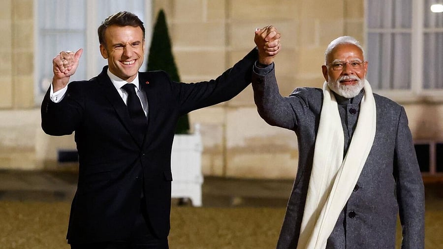 <div class="paragraphs"><p>French President Emmanuel Macron and Indian Prime Minister Narendra Modi hold hands on the day of a meeting with international investors in IA at the Elysee Palace as part of the Artificial Intelligence (AI) Action Summit in Paris, France, February 10, 2025.</p></div>
