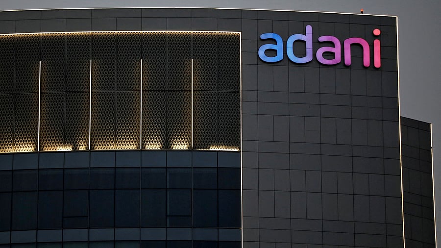<div class="paragraphs"><p>Logo of the Adani Group is seen on the facade of one of its buildings.</p></div>