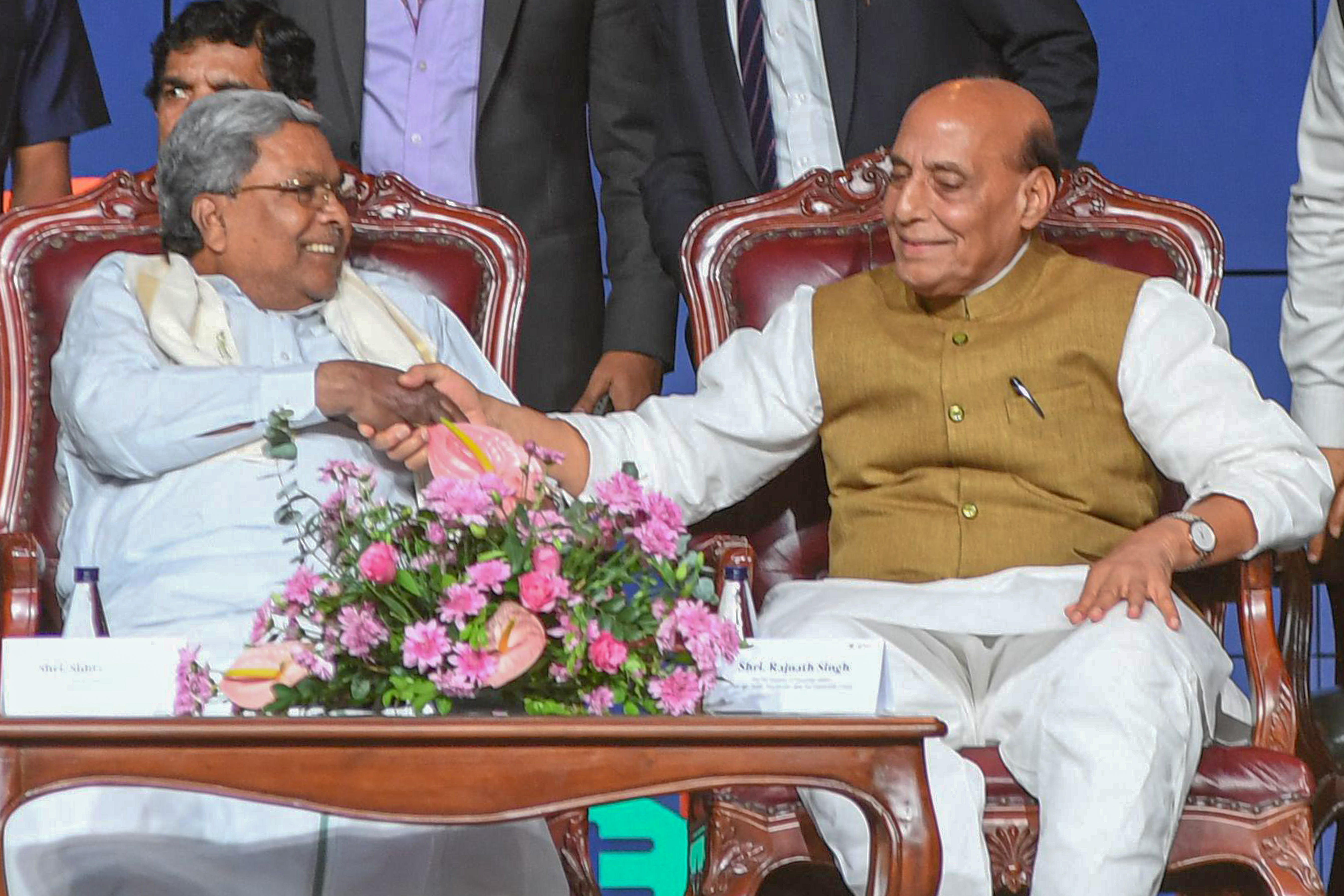 Defence Minister Rajnath Singh (R) with CM Siddaramaiah at the Global investors Meet in Bengaluru on Tuesday. DH Photo/S K Dinesh