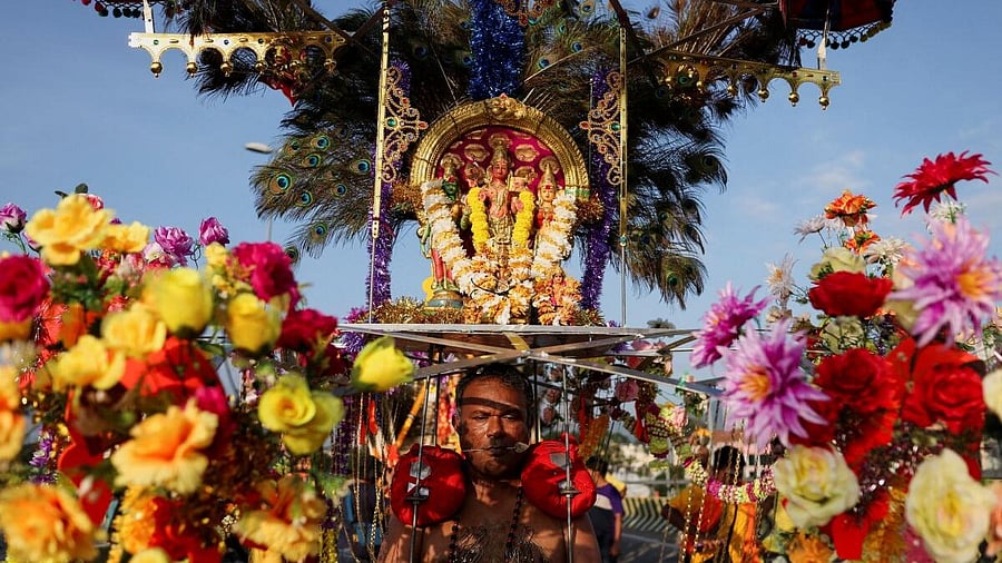<div class="paragraphs"><p>A Hindu devotee carries a Kavadi towards the temple during Thaipusam celebrations.</p></div>