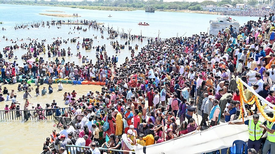 <div class="paragraphs"><p>Thousands of devotees take holy bath on 'Magha Poornima' Day, on the third day of Kumbh Mela, at T Narsipur, Mysuru district, on Wednesday.</p></div>