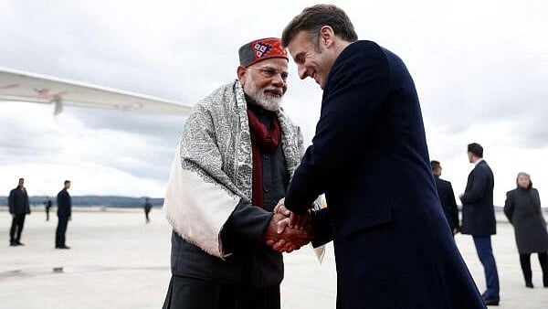 <div class="paragraphs"><p>French President Emmanuel Macron shakes hands with Indian Prime Minister Narendra Modi after a departure ceremony at Marseille Provence airport in Marignane as part of a visit in Marseille, France, February 12, 2025.</p></div>