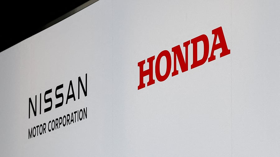 <div class="paragraphs"><p> Logos of Nissan Motor Corporation and Honda.</p></div>
