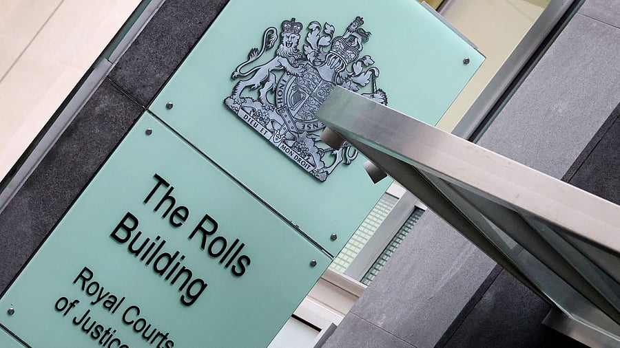 <div class="paragraphs"><p>A view shows a sign outside the Rolls Building of the High Court</p></div>