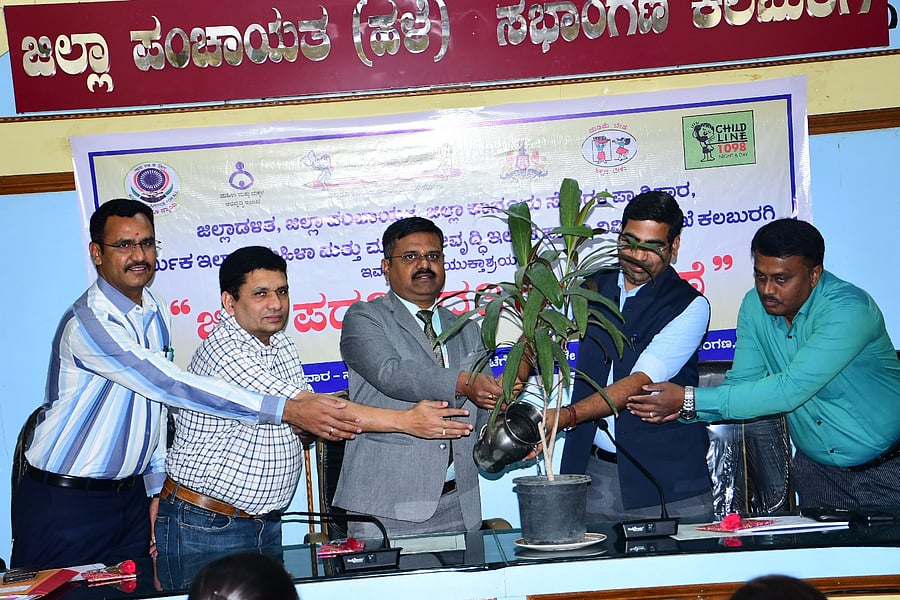<div class="paragraphs"><p>Senior civil judge and District Legal Services Authority member secretary Srinivas Navale waters a plant to inaugurate a programme organised to mark the Bonded Labour Abolition Day, in Kalaburagi on Friday. Zilla Panchayat Chief Executive Officer Bhanwar Singh Meena, District Labour Officer Sharanappa R H and others are present. </p></div>