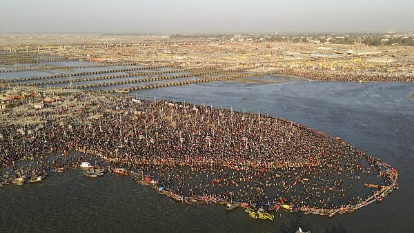 <div class="paragraphs"><p>An aerial view of devotees taking a holy dip at the Sangam area during the ongoing ‘Maha Kumbh Mela’ festival, in Prayagraj, Uttar Pradesh.&nbsp;</p></div>
