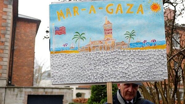 <div class="paragraphs"><p>A man holds a placard during a protest against President Donald Trump’s Gaza plan near the US Embassy in Dublin, Ireland, on Saturday.</p></div>
