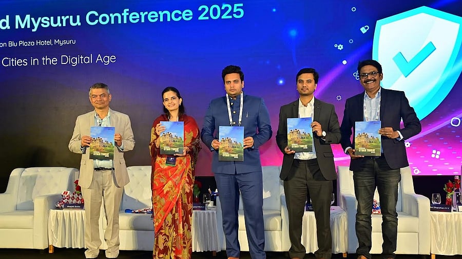 <div class="paragraphs"><p>Director for Electronics, IT, BT, and Science & Technology H V Darshan, CEO of DSCI Vinayak Godse, chairperson of Cyberverse Foundation Trishikha Kumari Wadiyar, MP and chairman of board of advisors of Cyberverse Yaduveer Krishnadatta Chamaraja Wadiyar and CEO of Quick Heal Technologies Vishal Salvi launch the ‘Cyberthreat Report’ in Mysuru, on Saturday. </p></div>