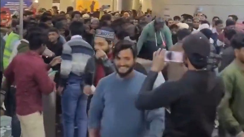 <div class="paragraphs"><p>Screengrab of video showing people hopping the turnstile</p></div>