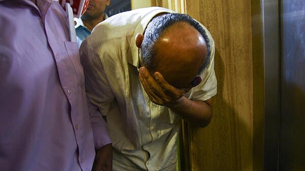 <div class="paragraphs"><p>Hitesh Mehta, General Manager and Head of Accounts at New India Cooperative Bank, after being arrested by the EOW, in Mumbai, Saturday, Feb. 15, 2025.</p></div>