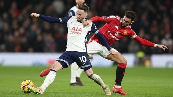 <div class="paragraphs"><p>Tottenham Hotspur's James Maddison in action with Manchester United's Bruno Fernandes</p></div>