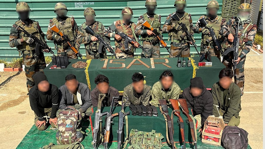 <div class="paragraphs"><p>Suspected Kuki National Army cadres in Churachandpur with weapons. </p></div>
