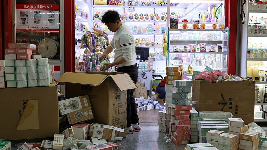 <div class="paragraphs"><p>A vendor works to unpack merchandise at a market in China </p></div>