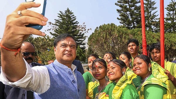 <div class="paragraphs"><p>Assam CM Himanta Biswa Sarma takes selfies with a group of women on the first day of the Budget session that began at the Bodoland Territorial Council (EIC) Assembly, in Kokrajhar, Monday. </p></div>