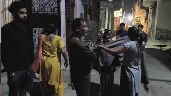 <div class="paragraphs"><p>People rushed out of their houses as earthquake tremors hit Delhi-NCR early Monday morning.</p></div>