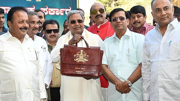 <div class="paragraphs"><p>Chief Minister Siddaramaiah arrives with a budget bag during the Karnataka budget 2024 at Vidhana Soudha</p></div>