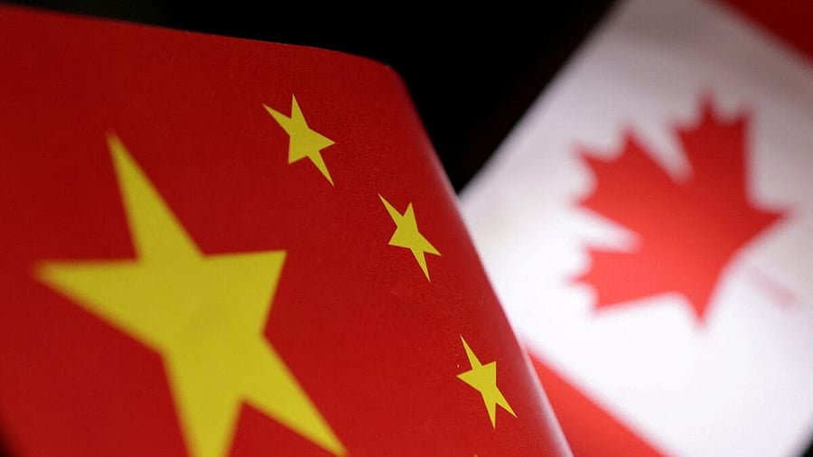 <div class="paragraphs"><p>Illustration shows printed Chinese and Canada flags</p></div>