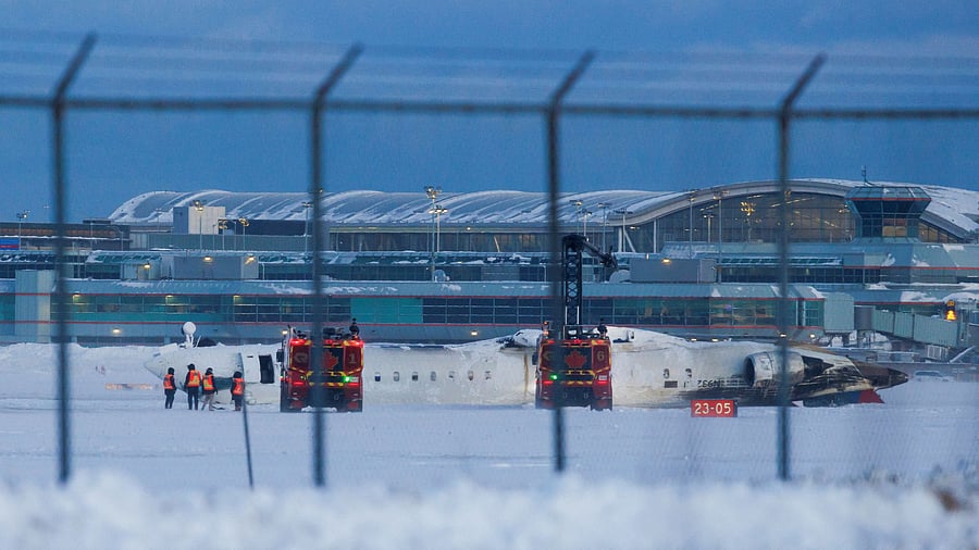 <div class="paragraphs"><p>Emergency responders operate around a plane on a runway after a plane crash at Toronto Pearson International Airport in Mississauga, Ontario, Canada February 17, 2025.</p></div>
