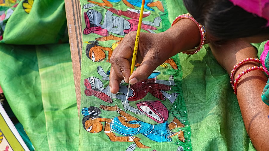 <div class="paragraphs"><p>Woman artist doing fabric painting on a hand loom sari. (For representational purpose)</p></div>
