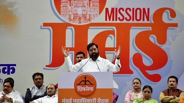 <div class="paragraphs"><p>Maharashtra Deputy Chief Minister and Shiv Sena chief Eknath Shinde addresses a gathering during a meeting of the party's MPs, legislators and office-bearers from the city, in Mumbai, Tuesday.</p></div>