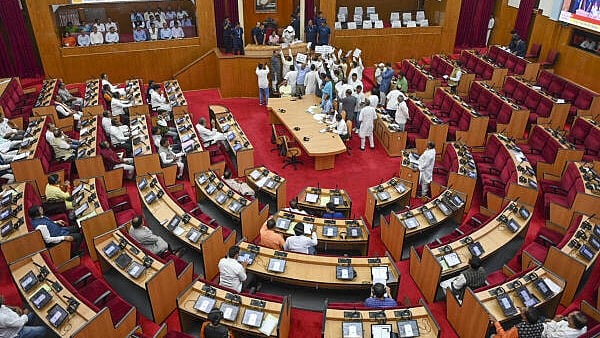 <div class="paragraphs"><p>Opposition BJD and Congress members stage a protest during a session of the Odisha Assembly, accusing the BJP government in the state of trying to 'saffronise' Mission Shakti by restructuring its executive committee, in Bhubaneswar, Wednesday, Feb. 19, 2025.</p></div>