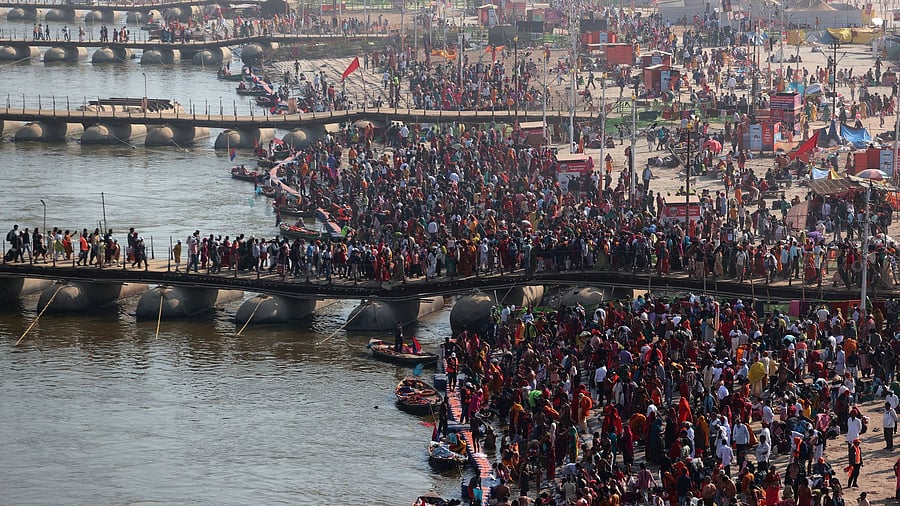 <div class="paragraphs"><p>Devotees gather to take a dip at Sangam, the confluence of the Ganges and Yamuna rivers with the mythical invisible Saraswati river, to mark Maghi Purnima, one of the auspicious days during the "Maha Kumbh Mela", in Prayagraj, February 12, 2025. </p></div>